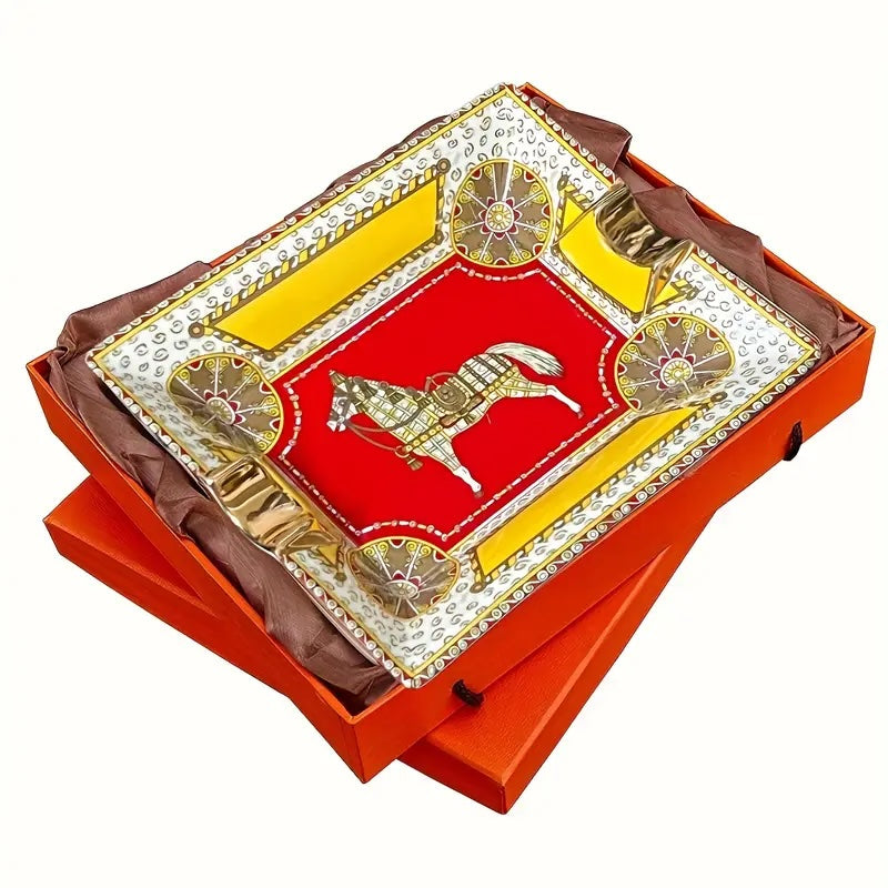 Decorative item with a bull emblem on a red background, placed inside an orange box.