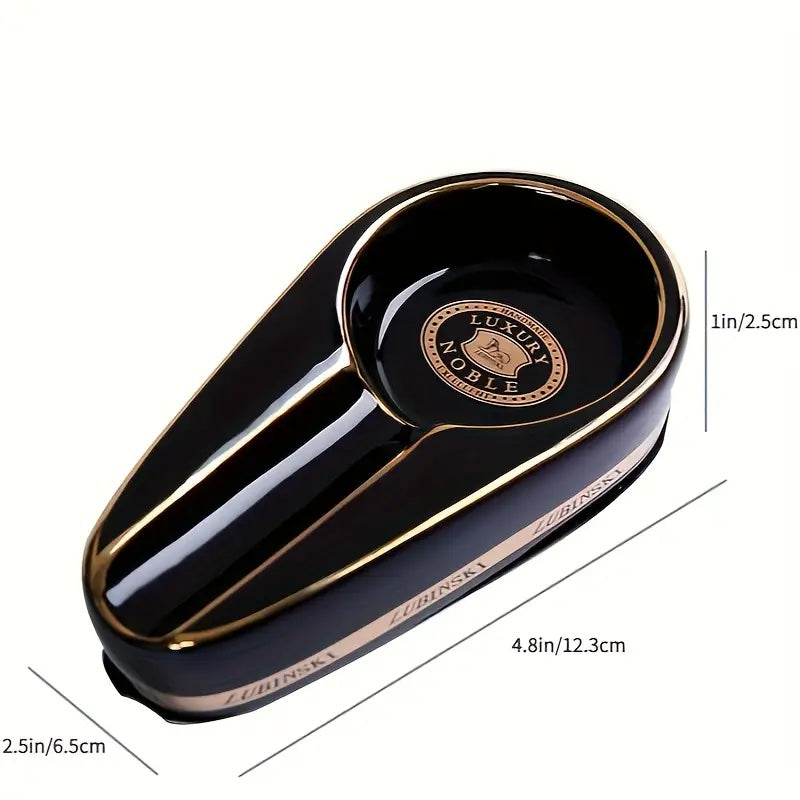 Black and gold spoon rest with measurements on a white background