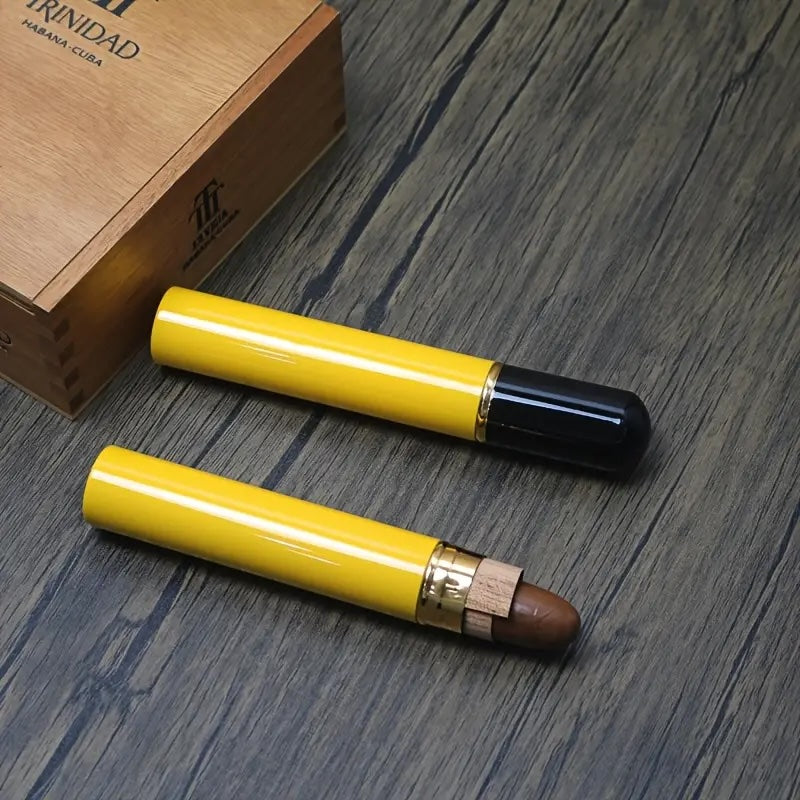 Two yellow canes with black and brown tips on a wooden surface, with a wooden box in the background.