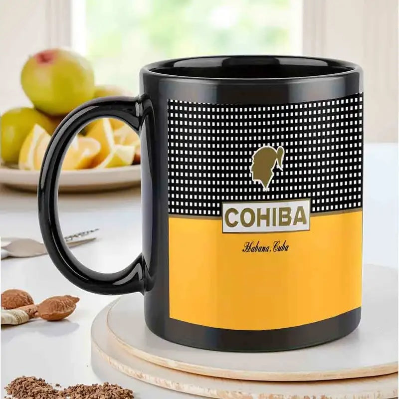 Cohiba branded mug on a table with fruits in the background
