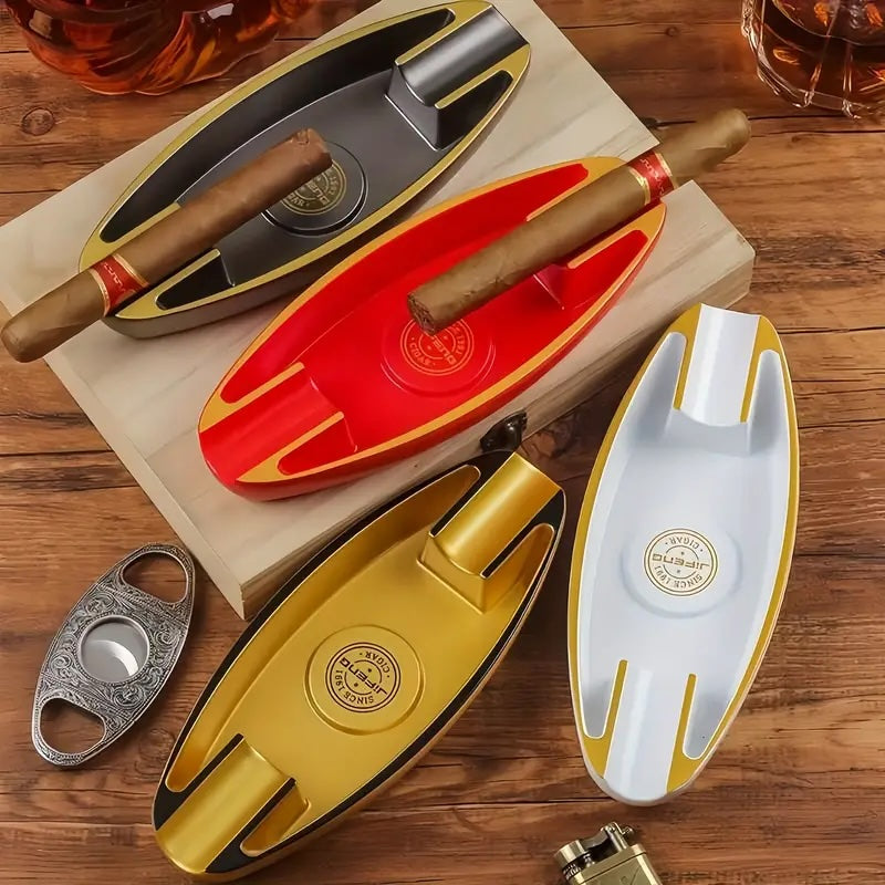 Set of colorful cigar holders with a cigar cutter on a wooden surface
