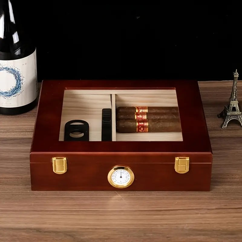 Wooden humidor with cigars and accessories on a wooden surface