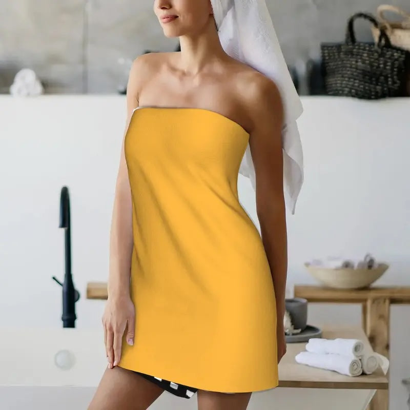 Woman wearing a yellow strapless dress in a spa setting