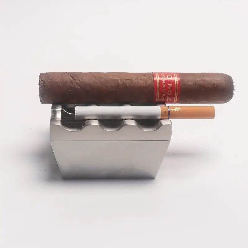 Cigar and lighter in a metal holder on a white background