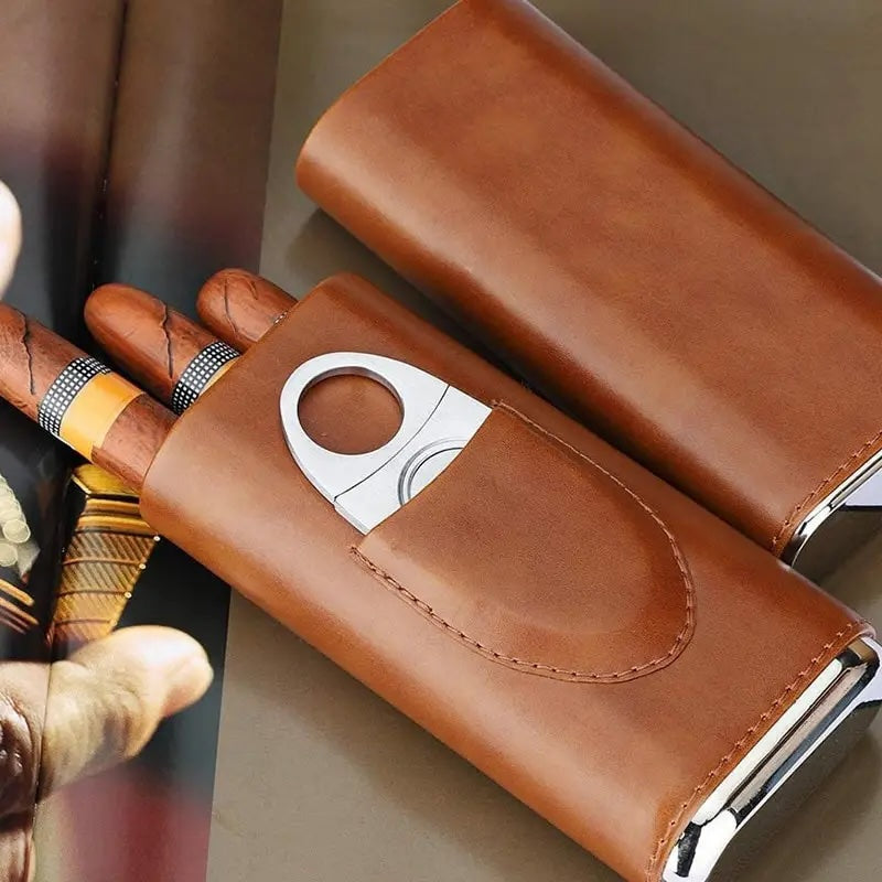 Brown leather cigar case with cutter and cigars held by a hand